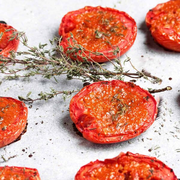 candied roma tomatoes on parchment