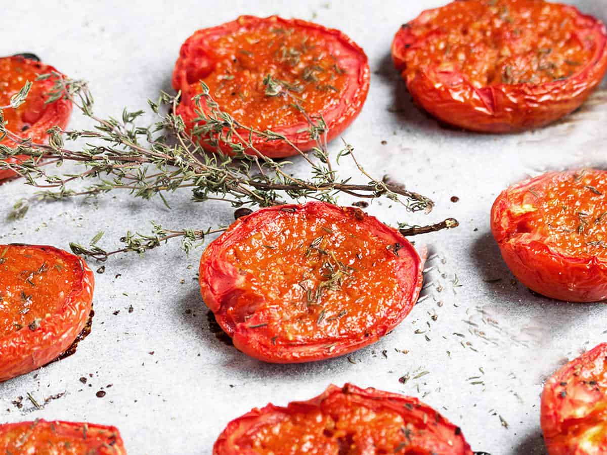 candied roma tomatoes on parchment