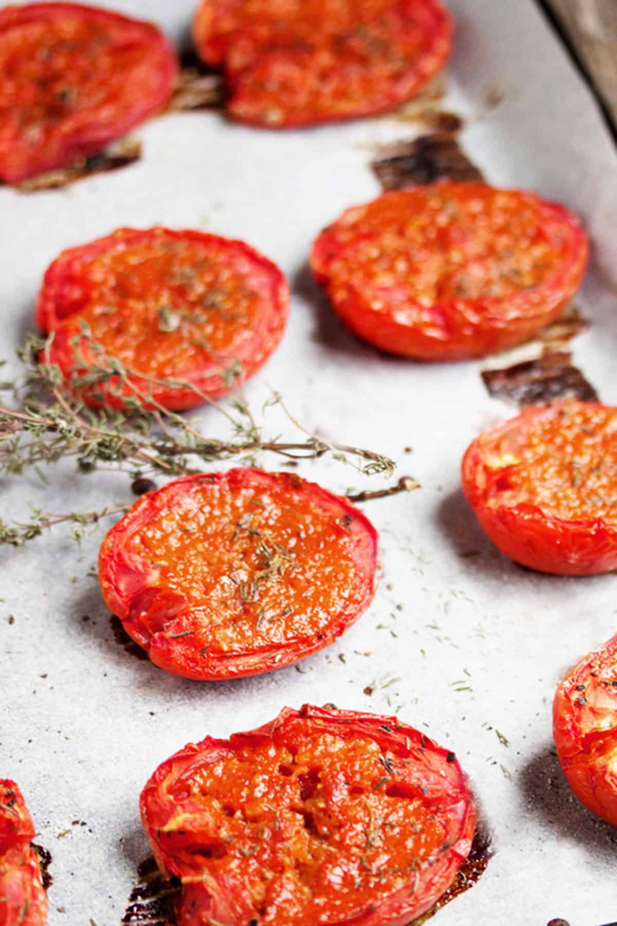 candied roma tomatoes on parchment