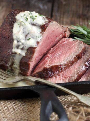 reverse seared chateaubriand on skillet with bernaise sauce