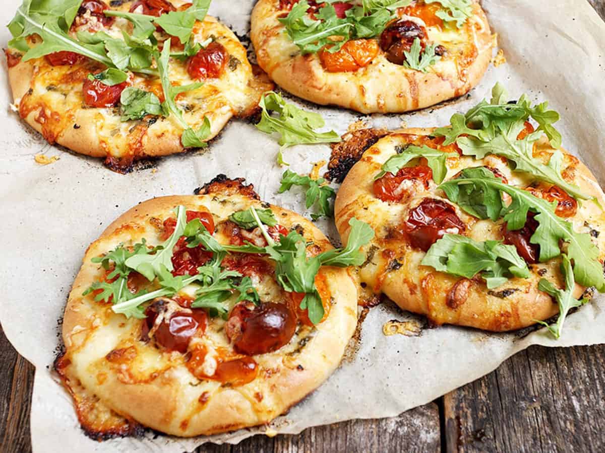 mini pizza with cherry tomatoes and bocconcini