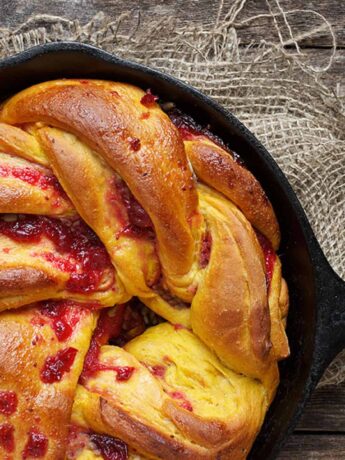 cranberry pumpkin Swirl Bread in cast iron skillet