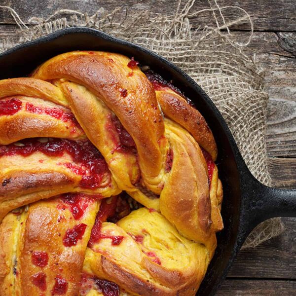 cranberry pumpkin Swirl Bread in cast iron skillet