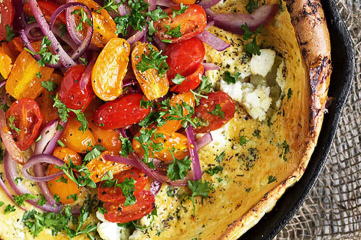 savoury tomato and goat cheese Dutch baby in skillet