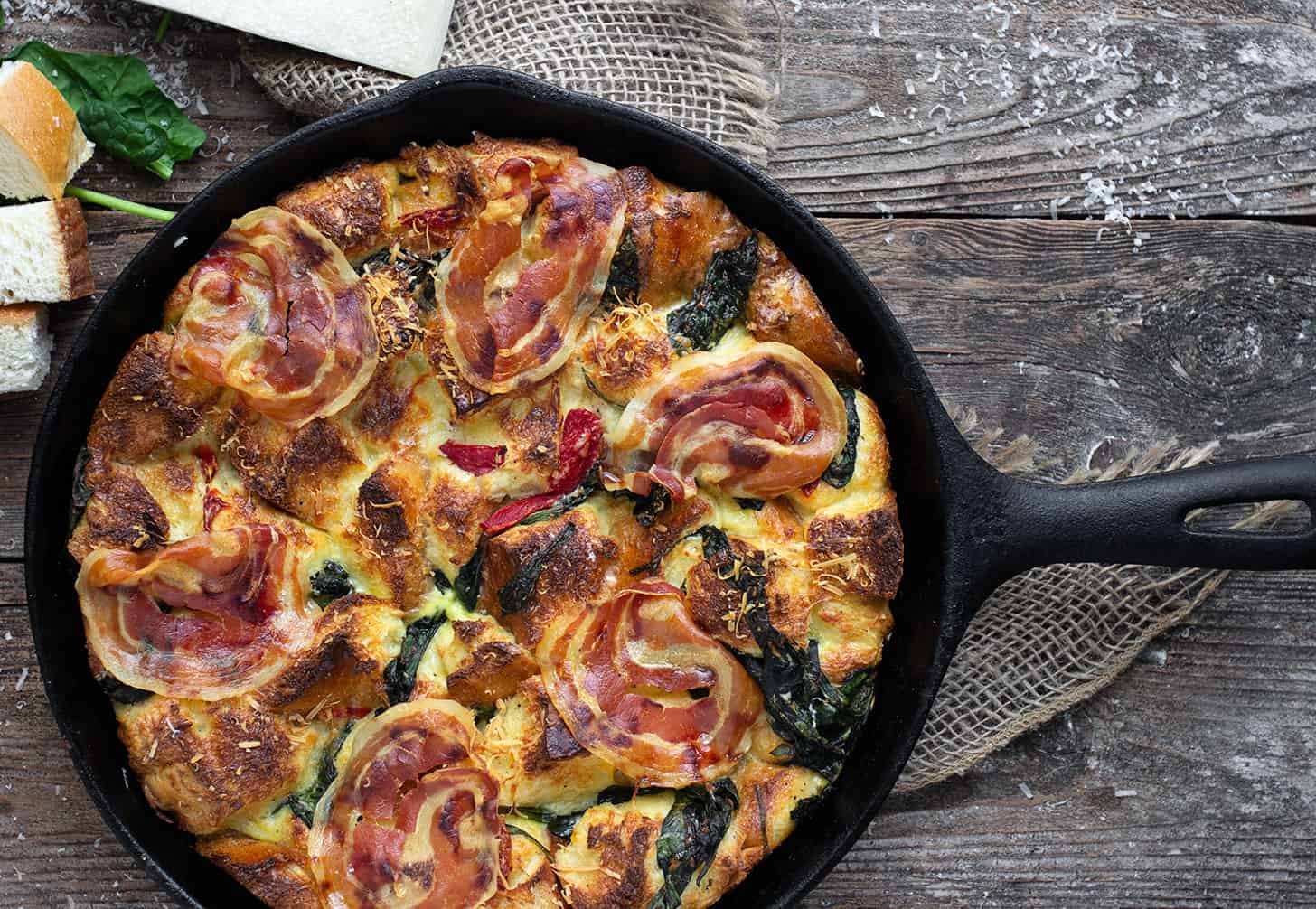 parmesan pancetta bread pudding in cast iron skillet