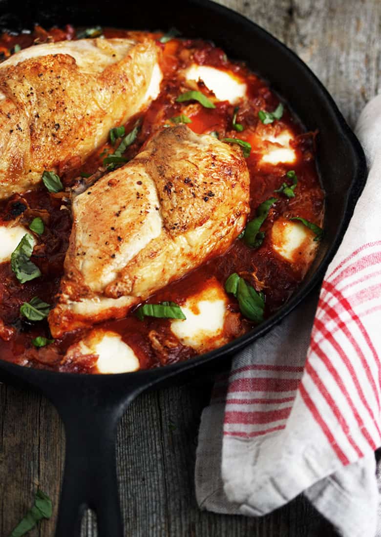 chicken breasts with tomato sauce and bocconcini in skillet