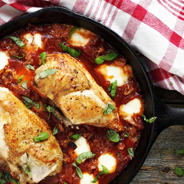 chicken breasts with tomato sauce and bocconcini in skillet