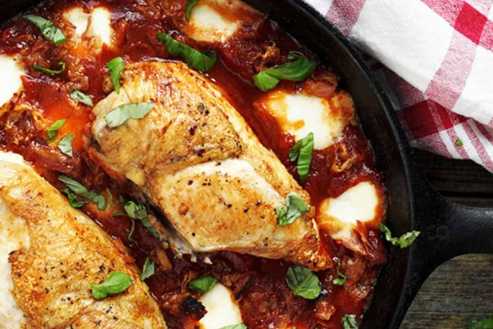 chicken breasts with tomato sauce and bocconcini in skillet