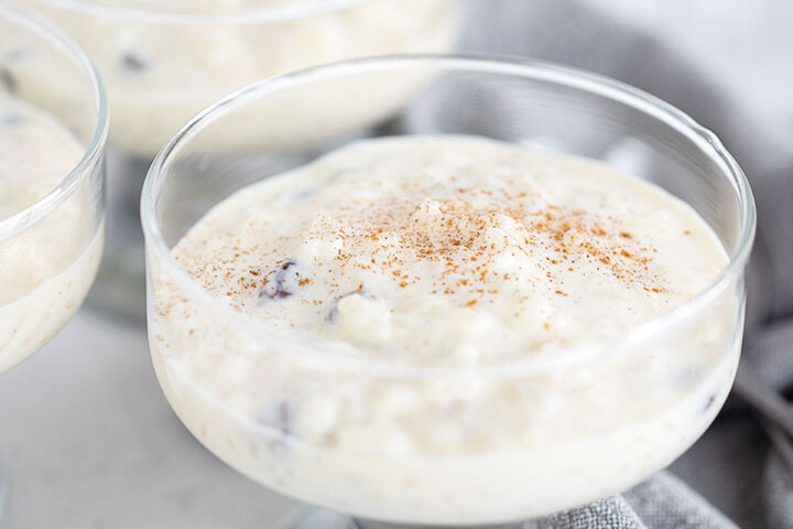 Creamy old-fashioned stovetop rice pudding in a serving glass dish.