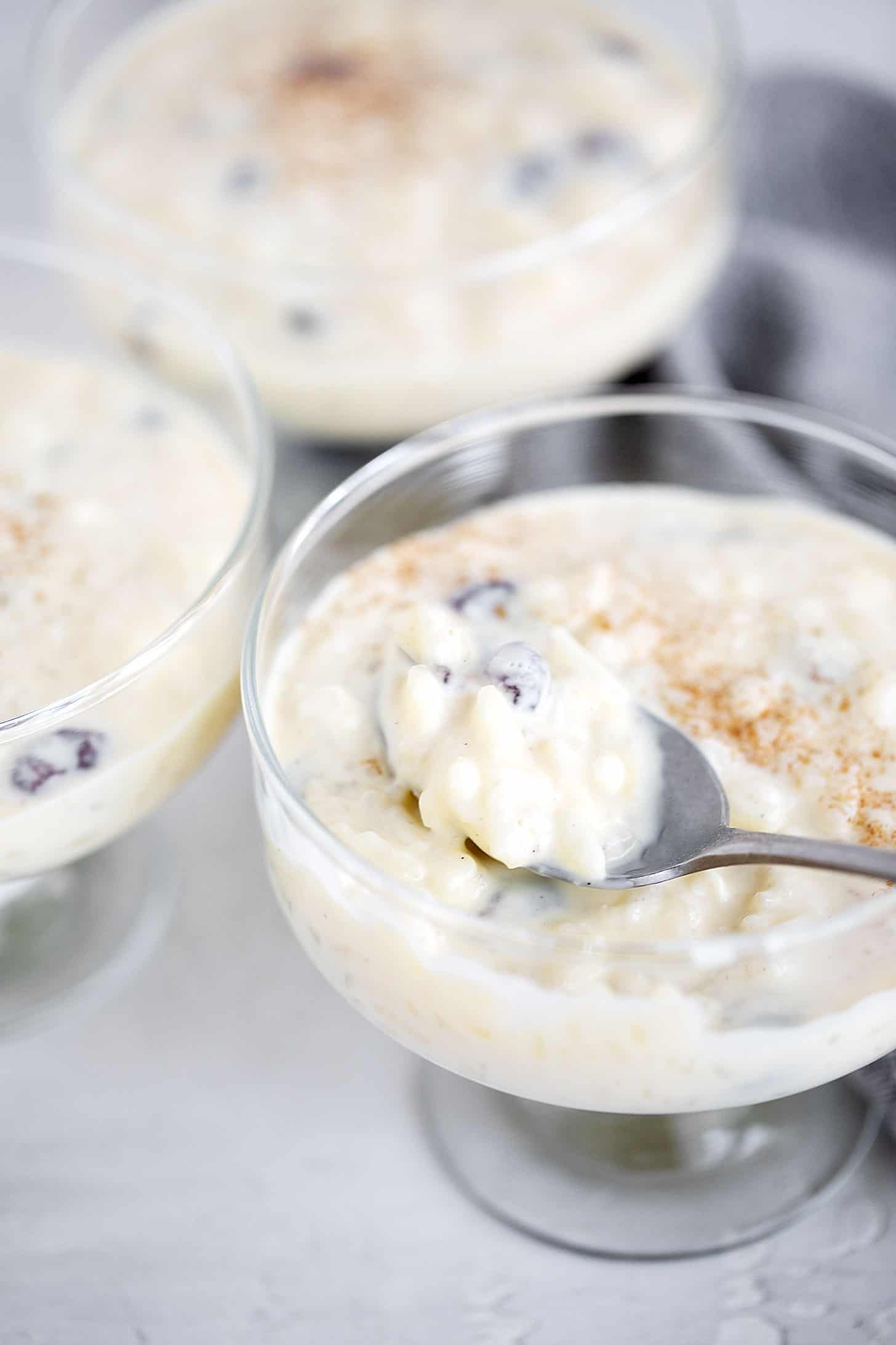 Creamy old-fashioned stovetop rice pudding in a serving glass dish.