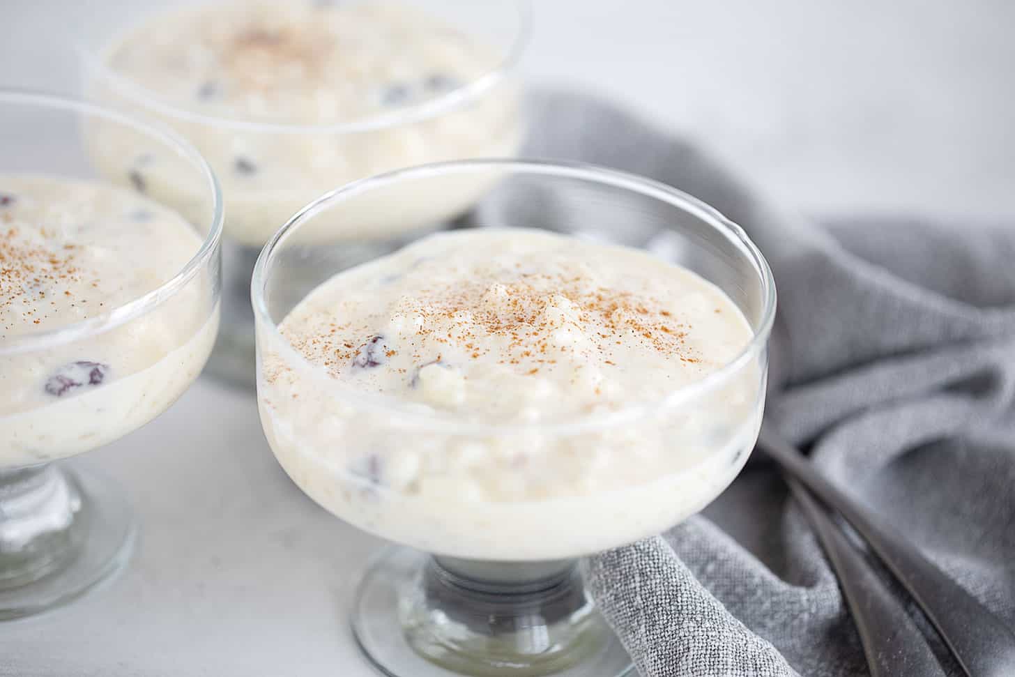Extra creamy rice pudding in a serving glass dish.