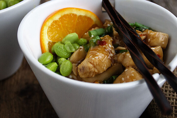 orange peel chicken in Asian bowl with chopsticks