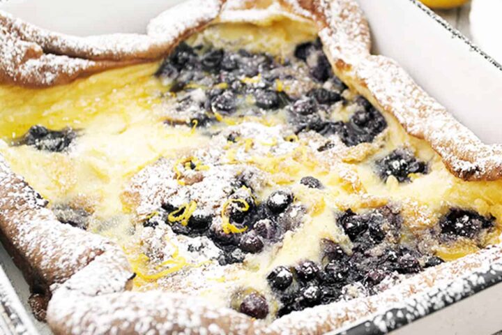 Finnish pancake with blueberries in pan