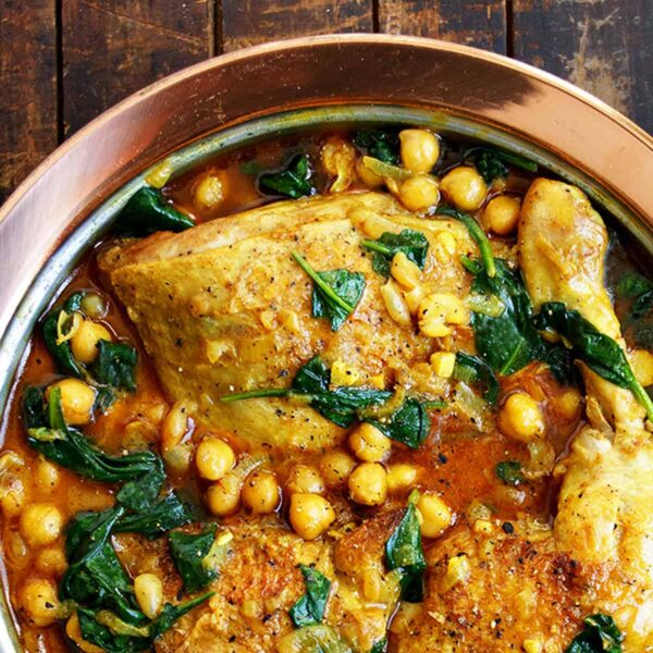 chicken chickpea curry in copper dish