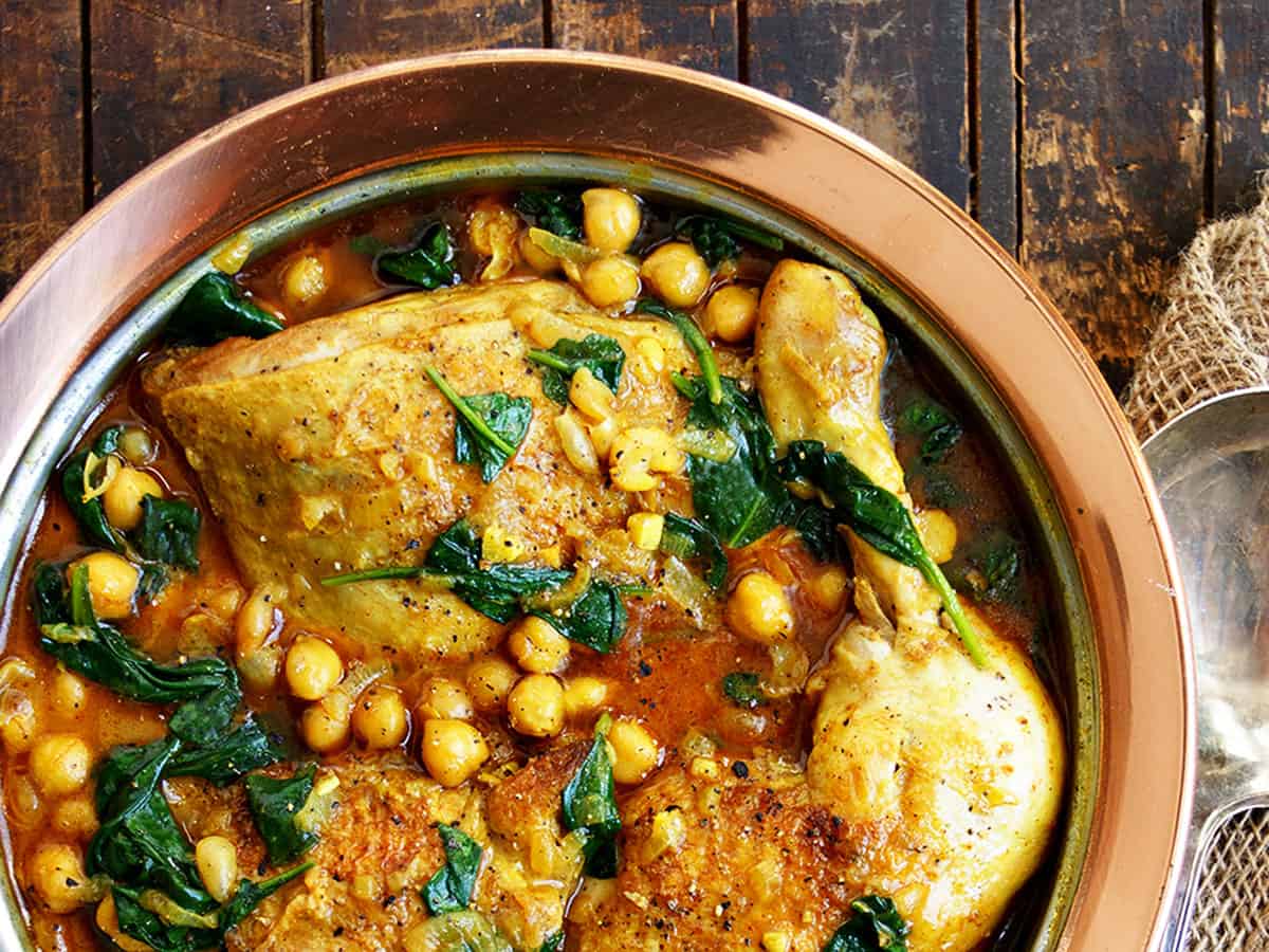 chicken chickpea curry in copper dish