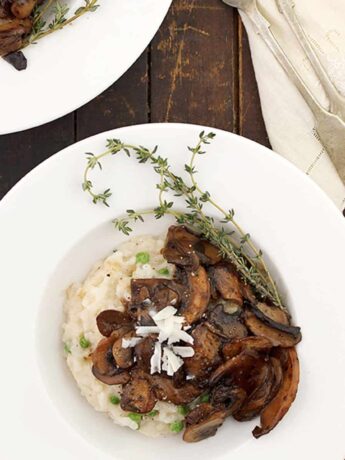 baked parmesan risotto topped with marsala wine mushrooms