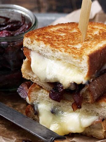 cheese curd grilled cheese on plate with bacon marmalade