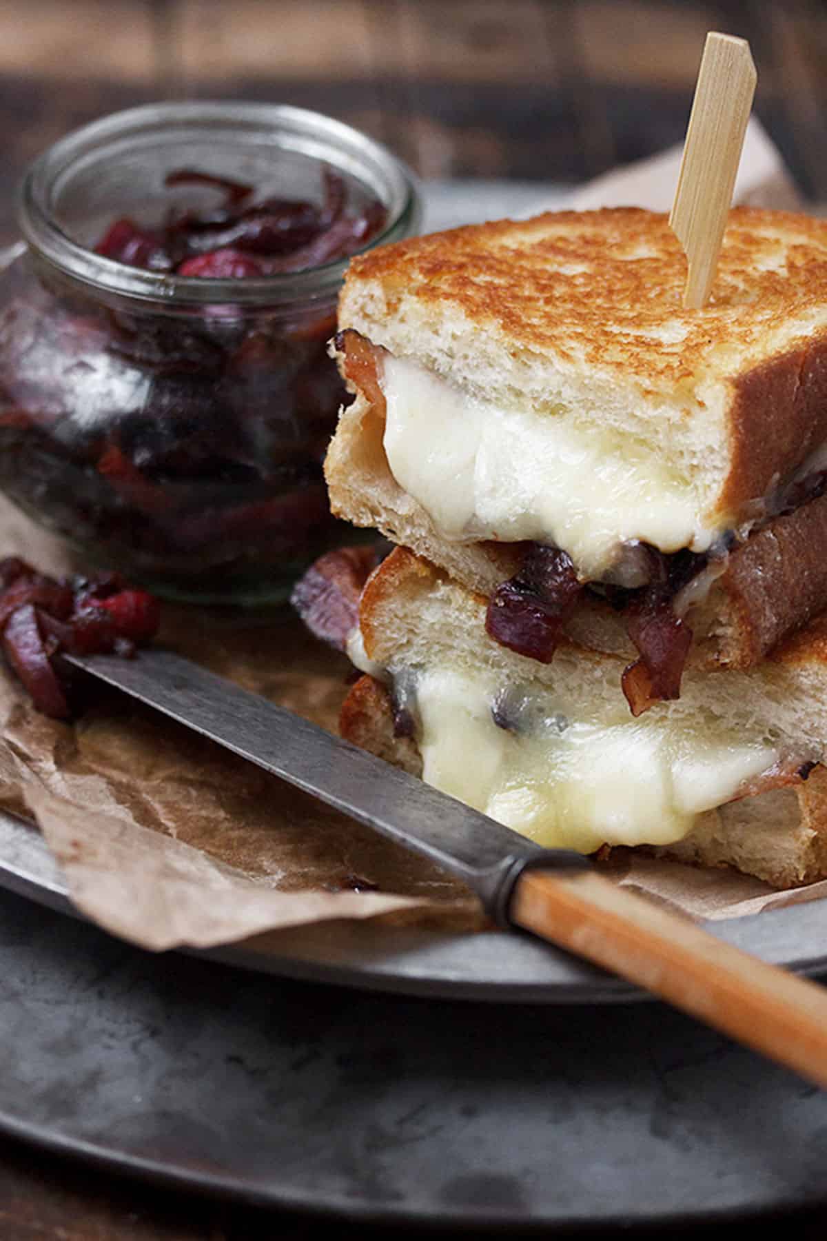 cheese curd grilled cheese on plate with bacon marmalade