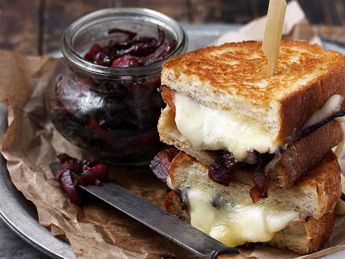 cheese curd grilled cheese on plate with bacon marmalade