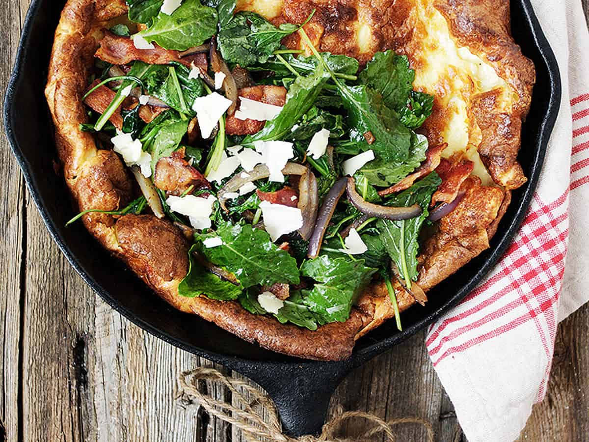 Kale bacon Dutch baby in cast iron skillet