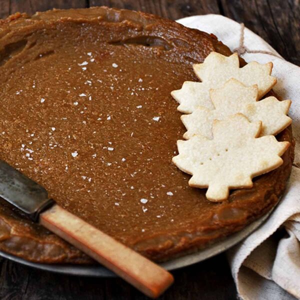 Canadian maple pie in plate with pastry maple leaves