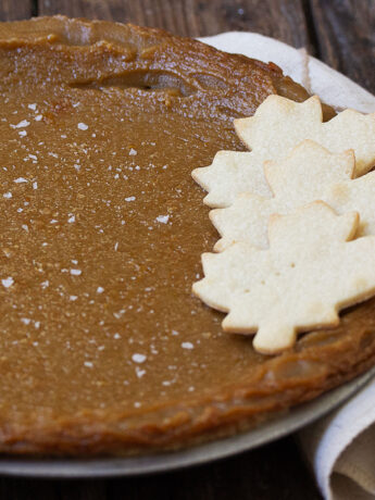 maple syrup pie in pan with pastry maple leaves on top