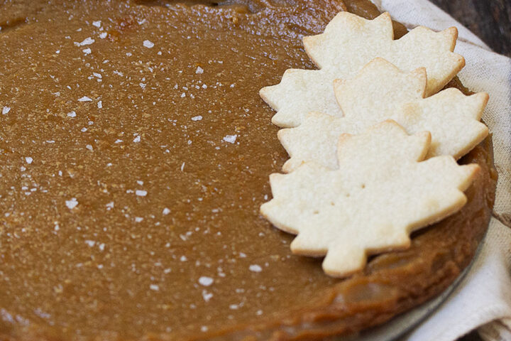 maple syrup pie in pan with pastry maple leaves on top