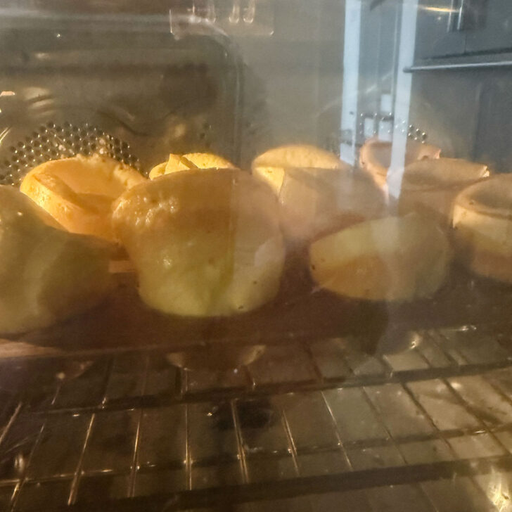 Mini Dutch baby pancakes baking in the oven.