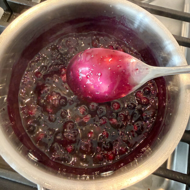 Finished blueberry sauce in the saucepan.
