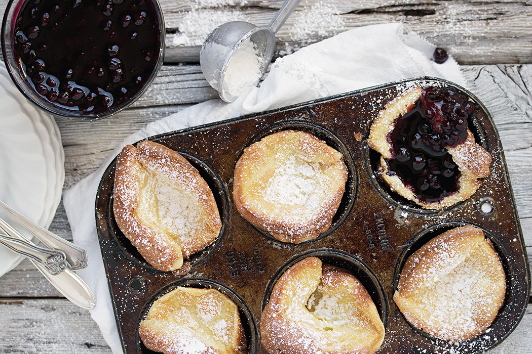 mini dutch baby pancakes in muffin tin