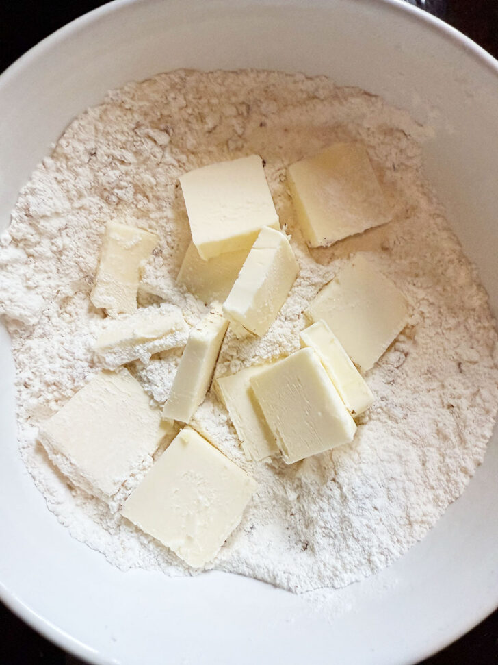 Cold butter added to the dry ingredients.