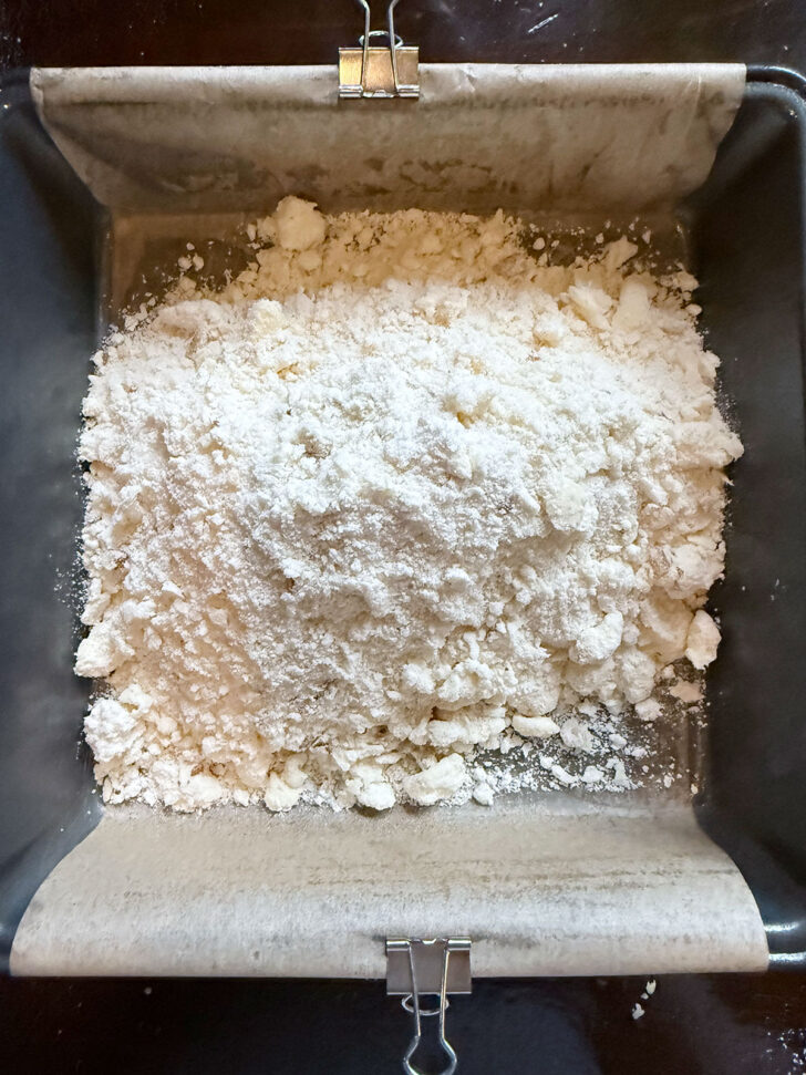 Crust mixture added to the prepared pan.