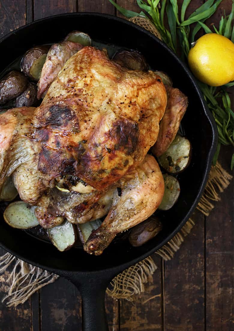 tarragon lemon roasted whole chicken in skillet