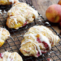 peach and raspberry scones on cooling rack