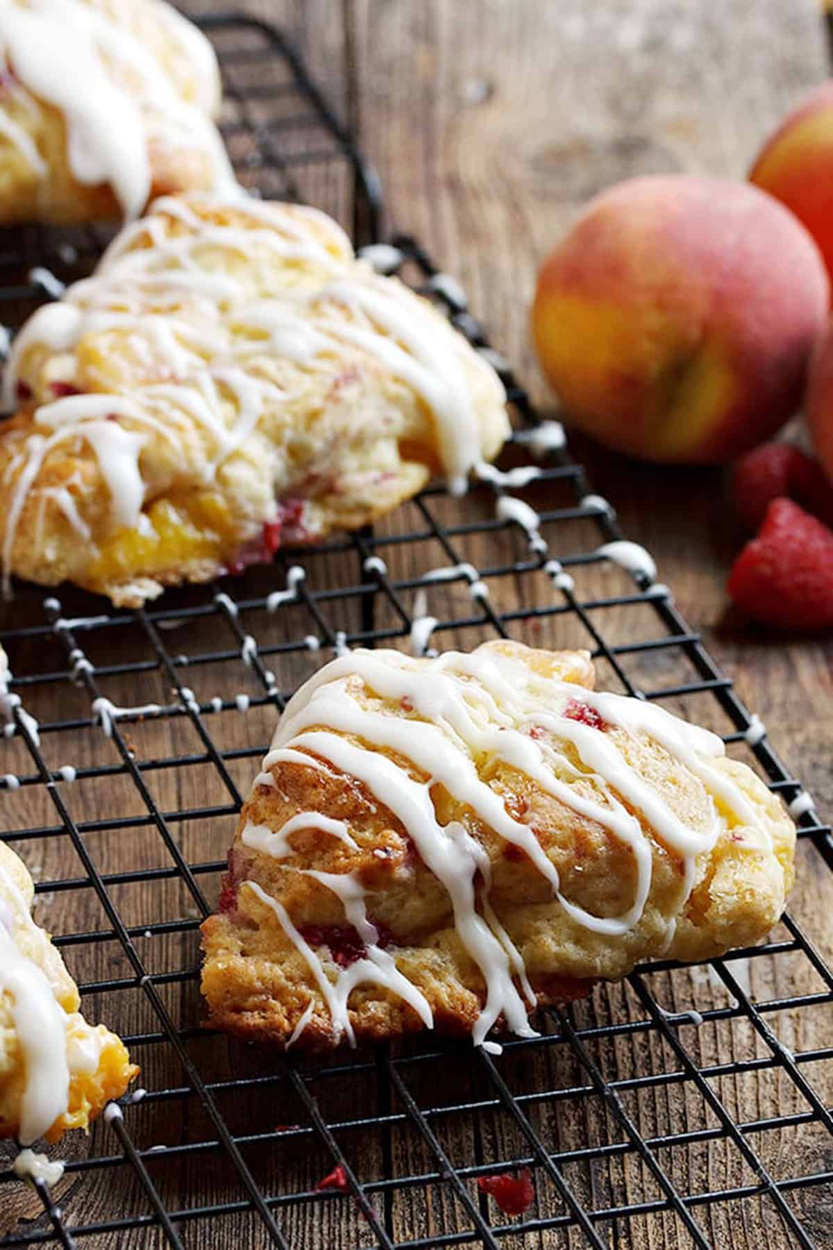 peach and raspberry scones on cooling rack