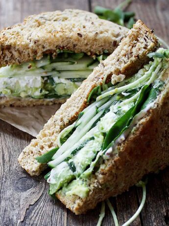 green goddess sandwich on wood background