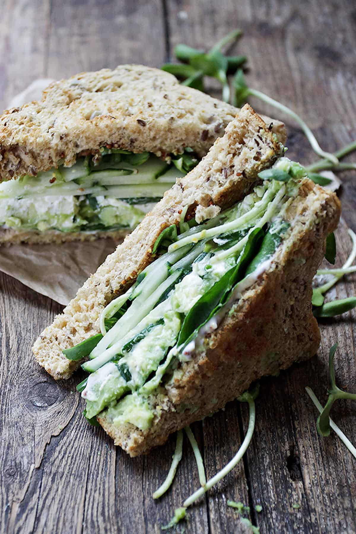 green goddess sandwich on wood background