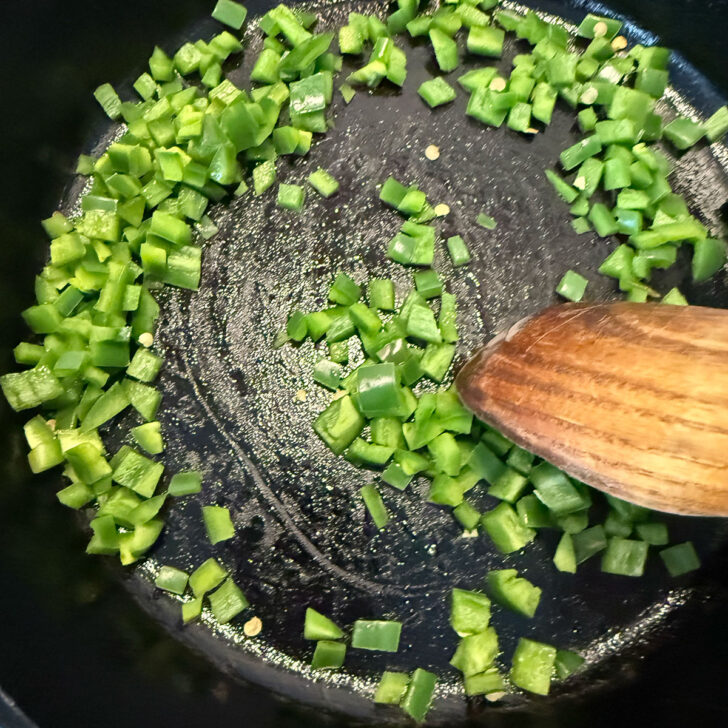 Diced jalapeño cooked in the cast-iron skillet.