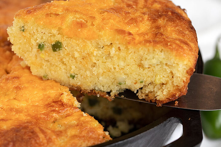 jalapeño cornbread in cast iron skillet sliced