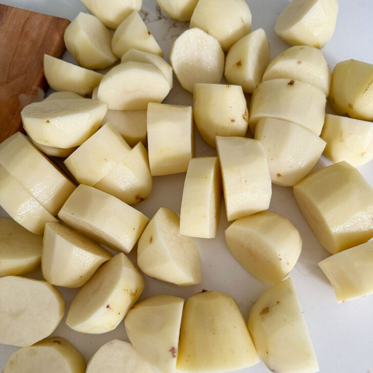 Russet potatoes after cutting into chunks.