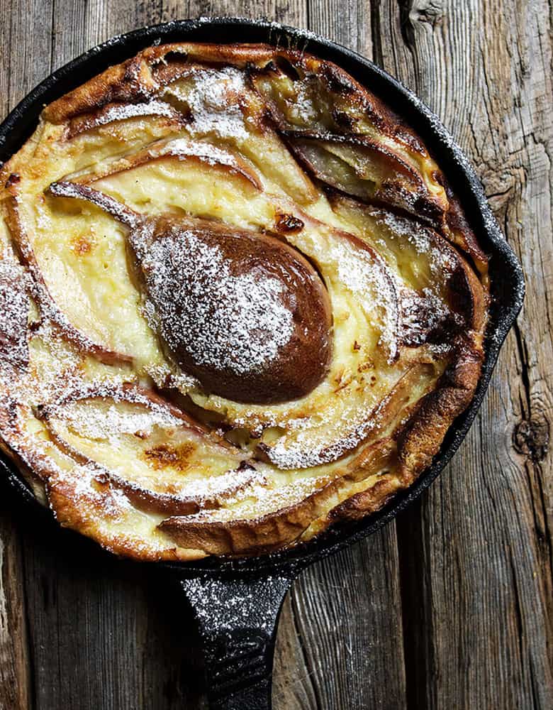 pear custard cake in small cast iron skillet