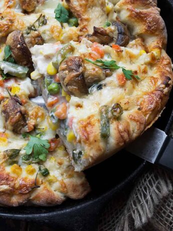 turkey pot pie pizza in cast iron skillet