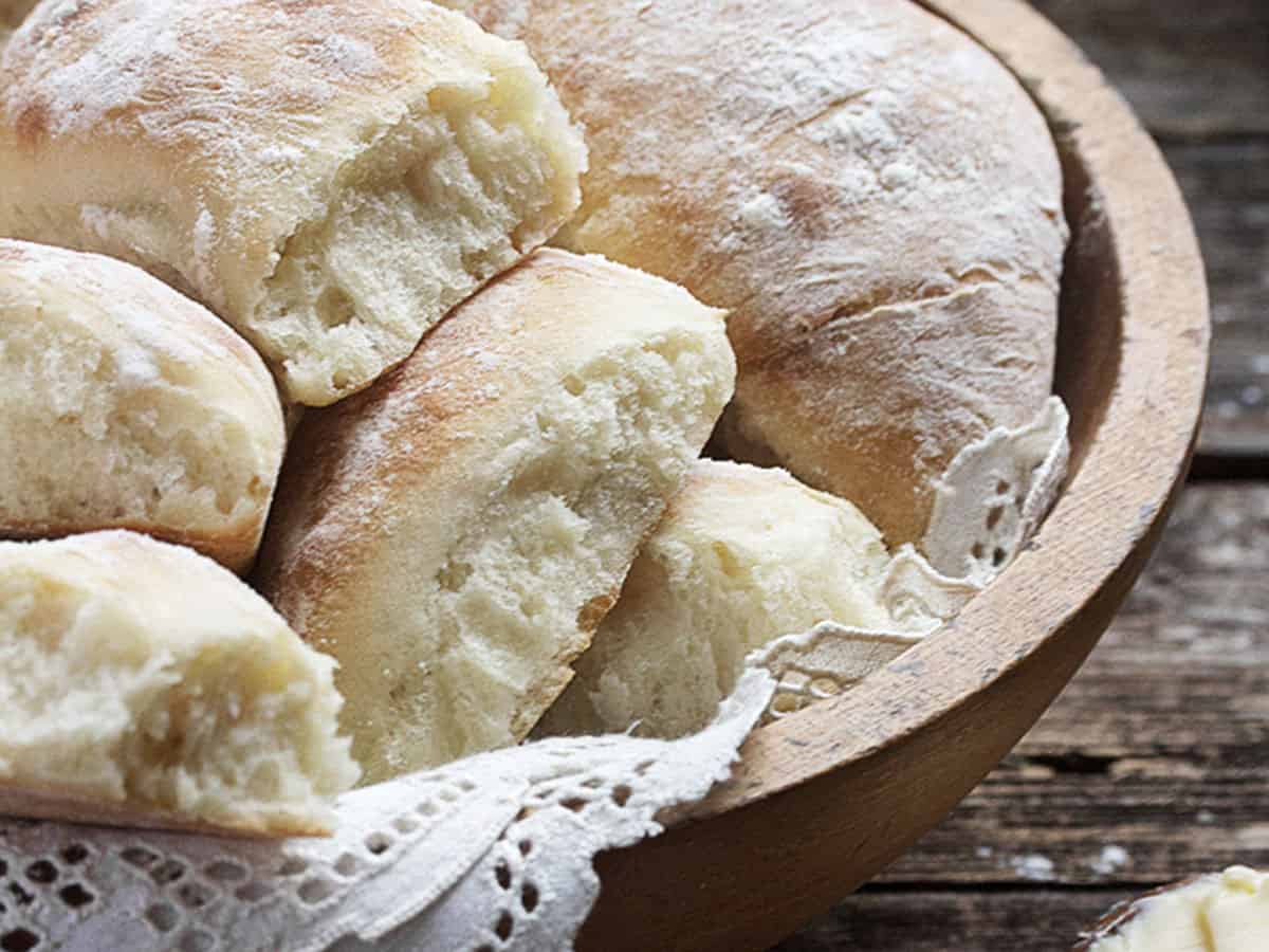 rustic potato rolls in wooden bowl