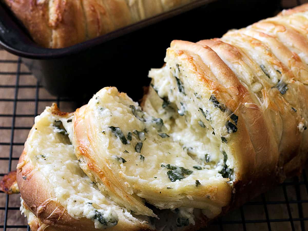 pull apart garlic cheese bread on cooling rack