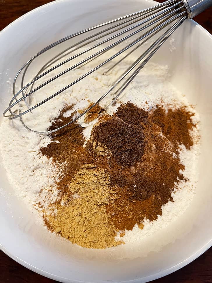 dry ingredients in bowl with whisk