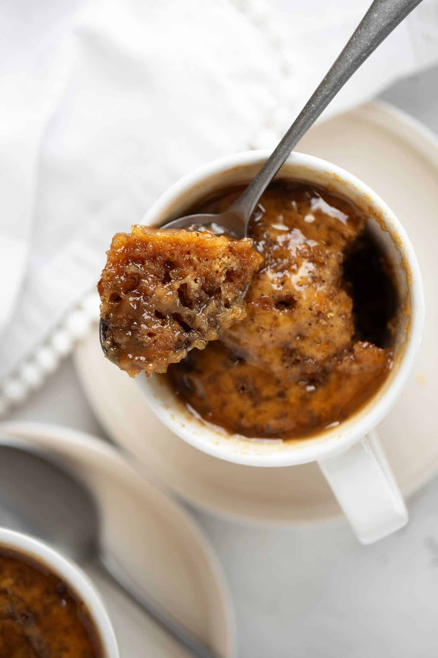 Microwave sticky toffee pudding in coffee cups.