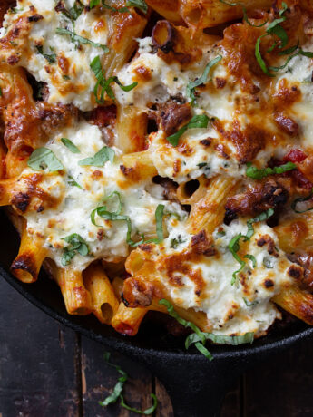 baked pasta with sausage and ricotta in cast iron skillet