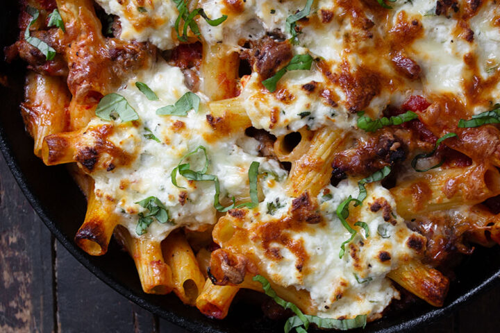 baked pasta with sausage and ricotta in cast iron skillet