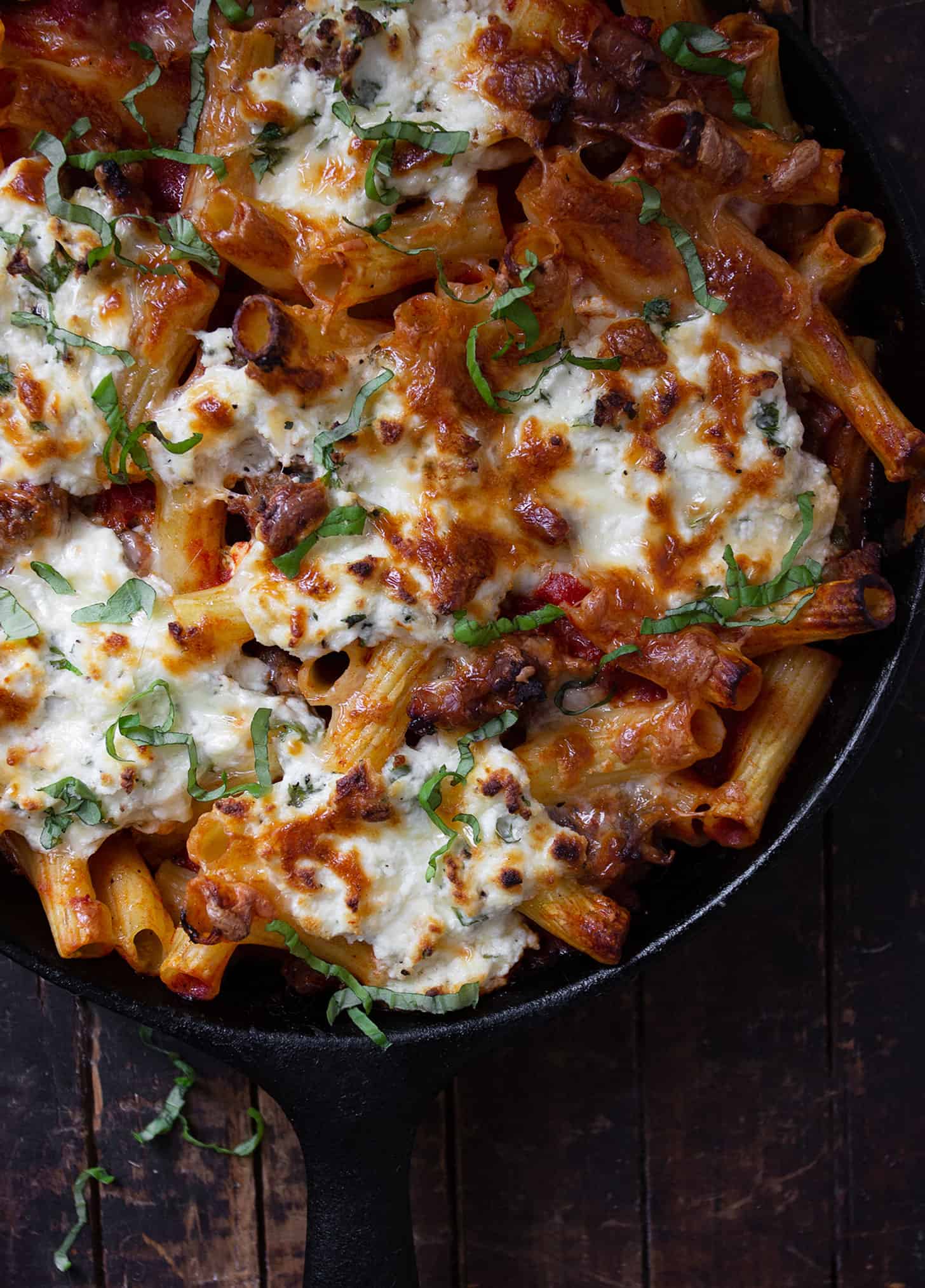 baked pasta with sausage and ricotta in cast iron skillet