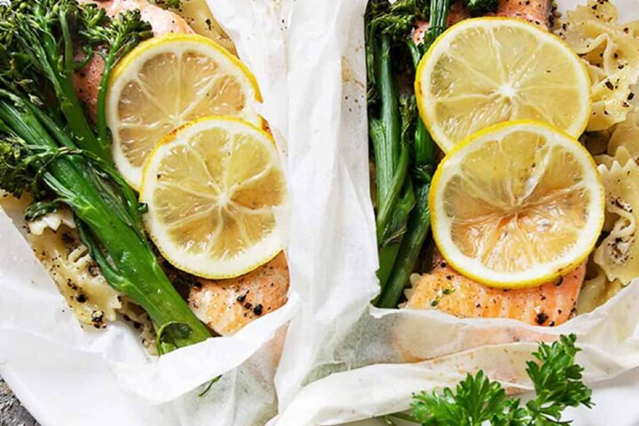 rainbow trout cooked in parchment with lemons, broccolini and pasta